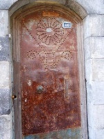 Old copper door in Bey Quarter